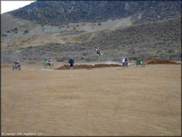 Kawasaki KX Dirt Bike getting air at Gardnerville Ranchos Gravel Pits Trail
