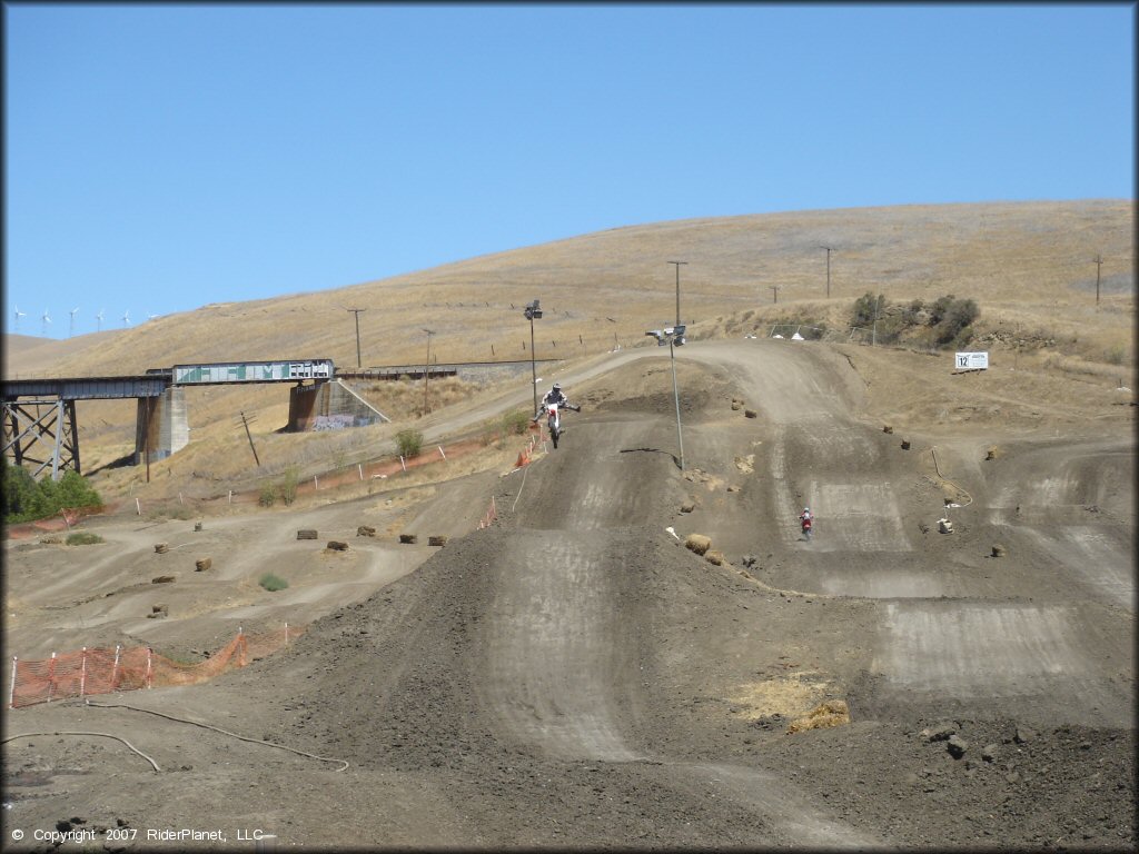 Honda CRF Dirt Bike catching some air at Club Moto Track