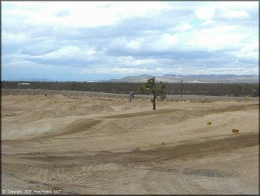 Dirtbike getting air at Adelanto Motorplex Track