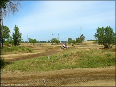 Honda CRF Dirt Bike jumping at Riverfront MX Park Track