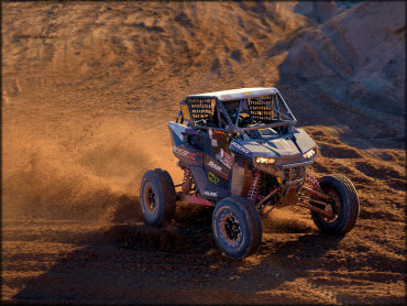 A RZR 1000 UTV Taking a High Speed Corner