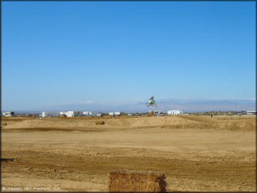 Kawasaki KX Dirt Bike jumping at Cal City MX Park OHV Area