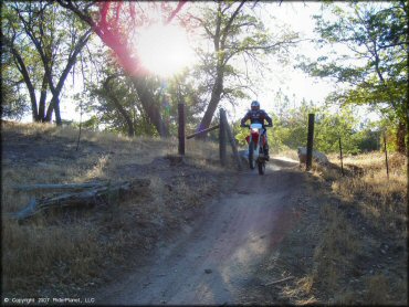 Honda CRF Motorcycle popping a wheelie at Lake Arrowhead Trail