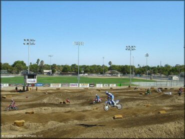 Yamaha YZ Dirt Bike jumping at Los Banos Fairgrounds County Park Track