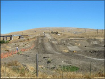 Dirt Bike catching some air at Club Moto Track