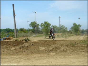 Honda CRF Motorbike catching some air at Riverfront MX Park Track