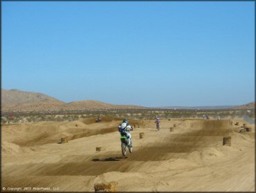 Kawasaki KX Dirt Bike jumping at Cal City MX Park OHV Area