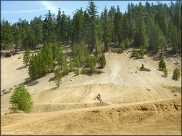 Honda CRF Dirt Bike getting air at Twin Peaks And Sand Pit Trail