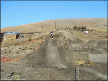 Honda CRF Dirt Bike jumping at Club Moto Track