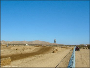 Motorcycle catching some air at Cal City MX Park OHV Area