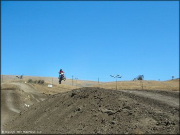 Dirt Bike jumping at Club Moto Track