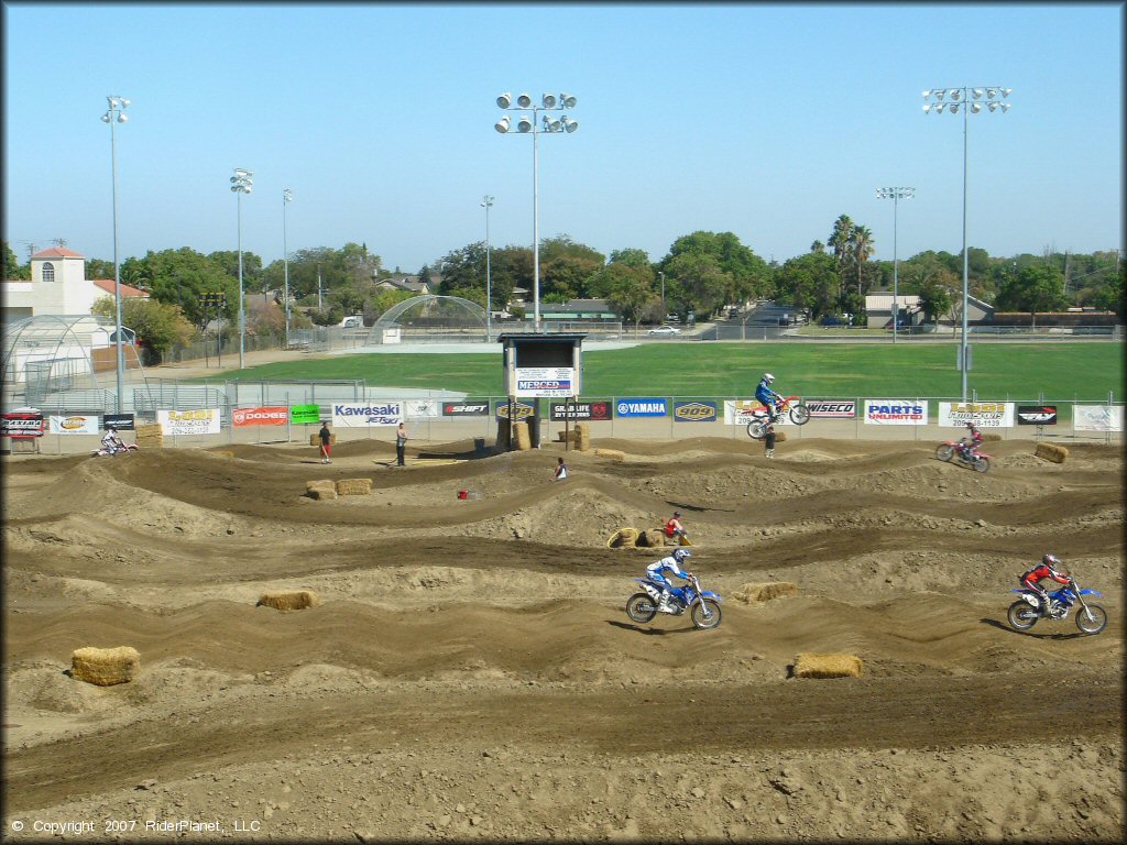 Yamaha YZ Dirtbike catching some air at Los Banos Fairgrounds County Park Track