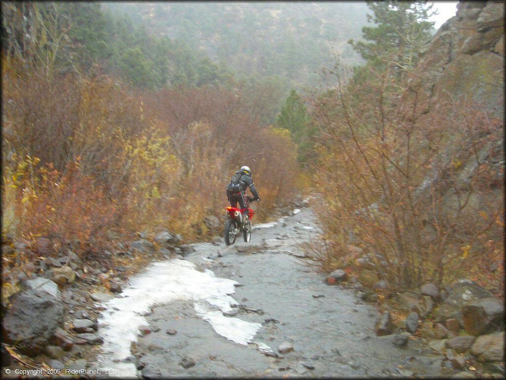 Honda CRF Dirt Bike in the water at Leviathan Recreation Area Trail