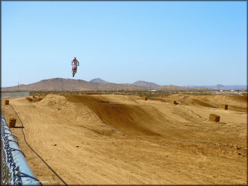 Honda CRF Dirt Bike getting air at Cal City MX Park OHV Area