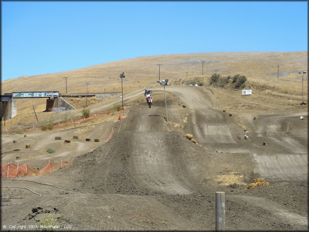 Honda CRF Motorbike catching some air at Club Moto Track